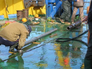 Sea-floor sediment core, on deck. Photo © NOAA Pacific Marine Environmental Laboratory